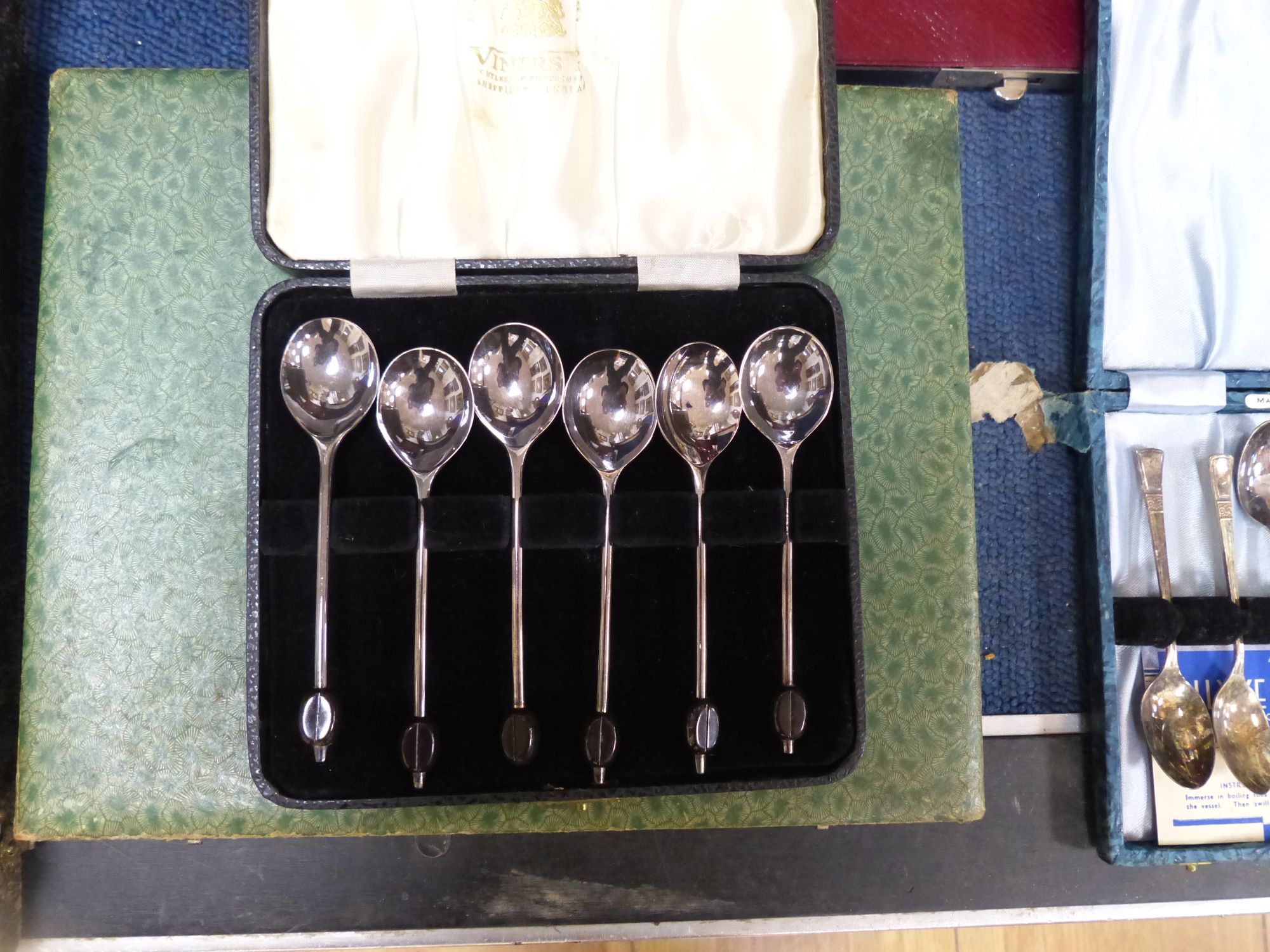 Eight assorted cased sets of silver plated cutlery including dessert eaters and a plated part toilet set.